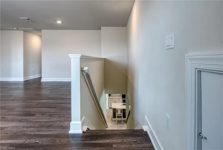Staircase with wood-type flooring