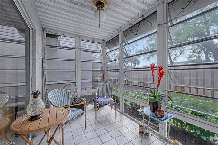 Sunroom with plenty of natural light and a ceiling fan