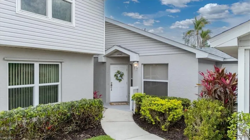 Property entrance featuring stucco siding
