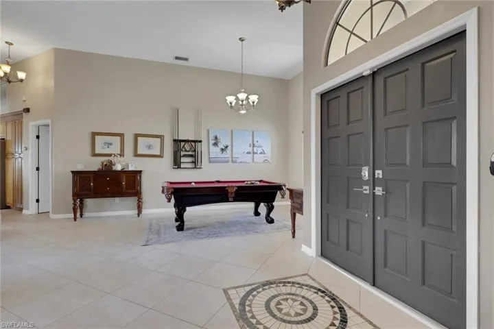 Double entry doors with an arched transom window