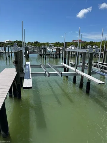 Dock with a water view and boat lift