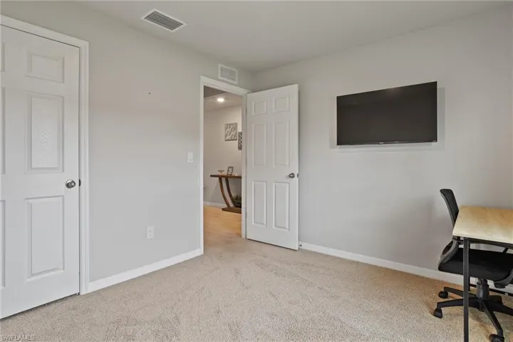 Office featuring carpet floors and baseboards