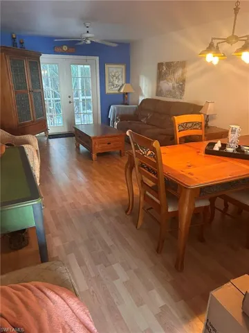 Dining room with ceiling fan and light wood-style floors