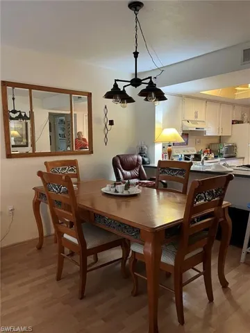 Dining area with light wood-style flooring