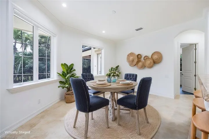 Virtually Staged - Dining area off the kitchen and great room.