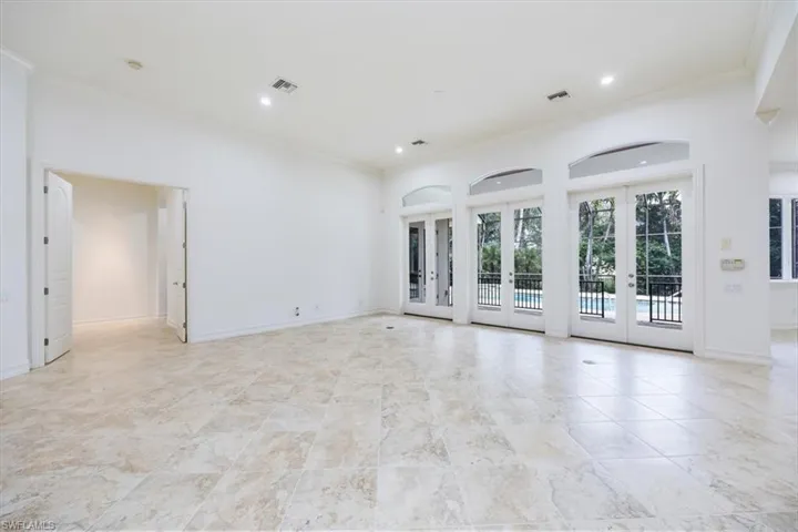 Great room with access to the kitchen and the pool/spa/lanai thru french doors.