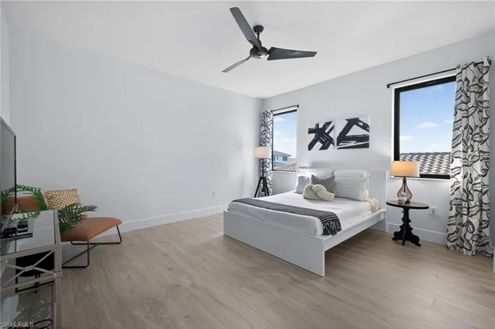 Bedroom featuring a ceiling fan and light wood-style floors
