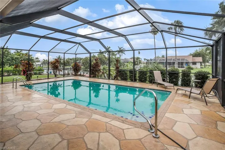 Pool and lanai view perfectly situated overlooking the canal and Western exposure.