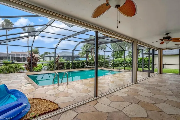 Extra spacious pool area and lanai with storm shutters.