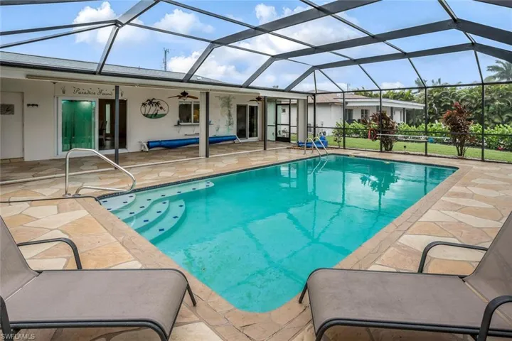 Pool and deck have been resurfaced, reinforced screen, and extended lanai. Paradise Found lovingly named by the owners!