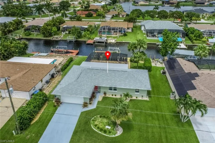 Terrific SW Cape location with open water access in less than one hour! A must see - new roof 2022, professionally remodeled interior, plus caged POOL!