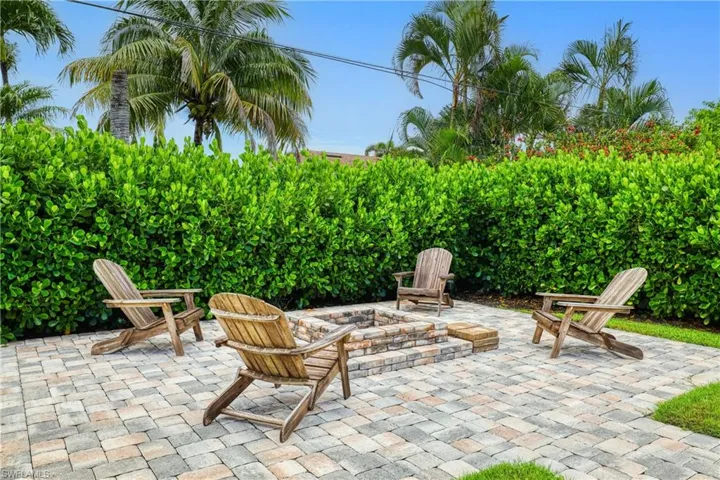 View of patio with a fire pit