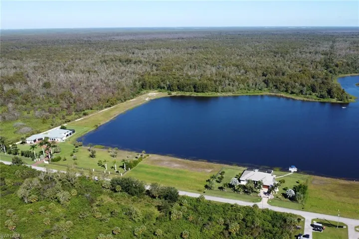 Aerial view of property's location featuring a nearby body of water