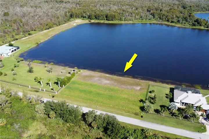 Aerial view of a heavily wooded area and a nearby body of water
