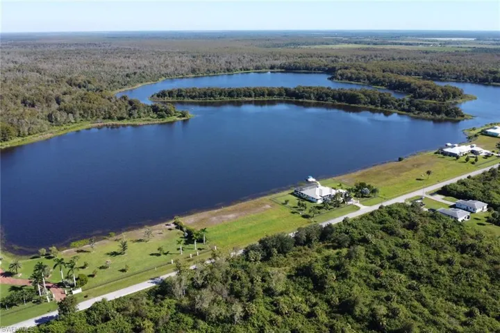 Bird's eye view of a heavily wooded area and a large body of water