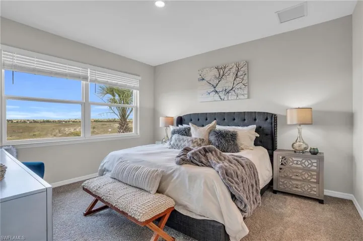 Bedroom with recessed lighting, carpet flooring, visible vents, and baseboards