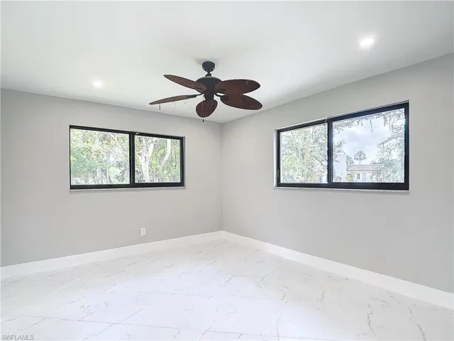 Unfurnished room featuring ceiling fan