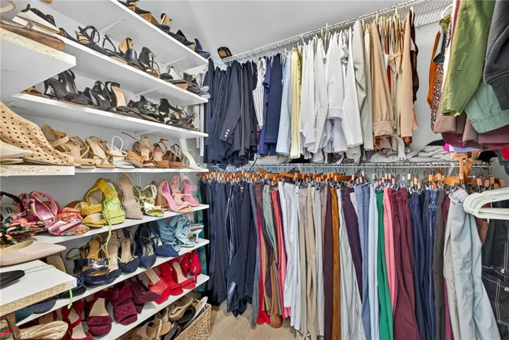 Spacious closet with light wood-style flooring