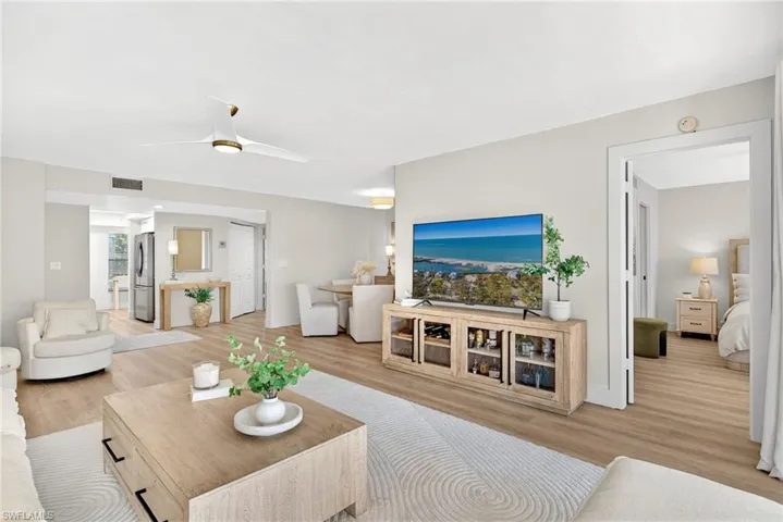 Living room featuring light wood-style floors and ceiling fan