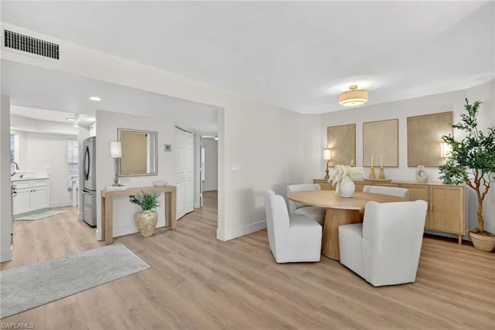 Dining space featuring light wood-type flooring and baseboards