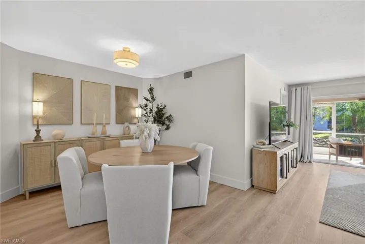 Dining area with light wood-type flooring