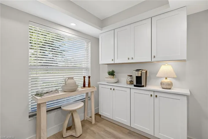 Home office featuring light wood-style floors and recessed lighting