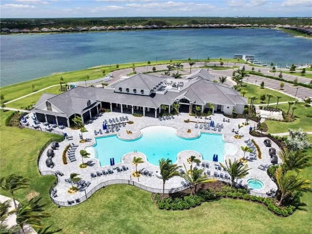 Drone / aerial view of a large body of water and a pool