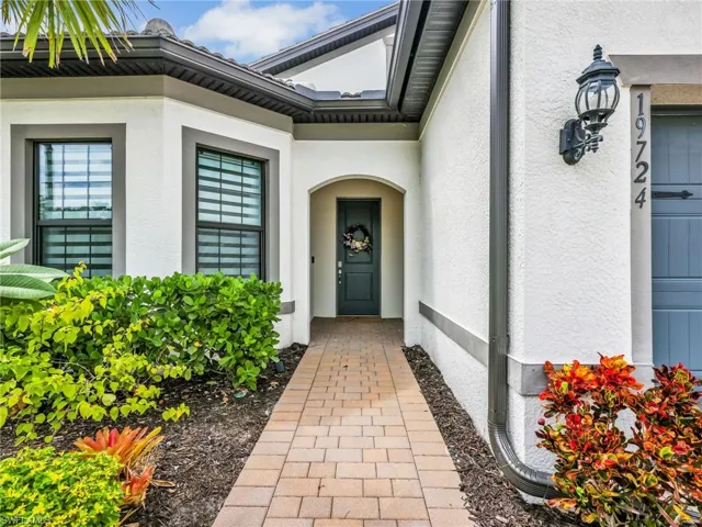 Doorway to property with stucco siding