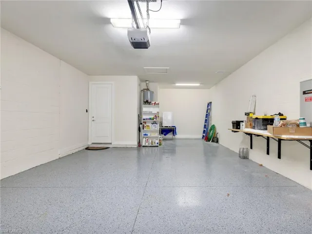 Garage with concrete block wall and a garage door opener