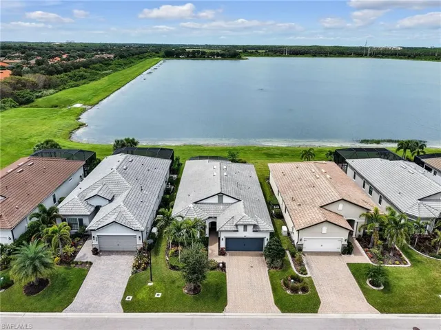 Aerial perspective of suburban area with a large body of water
