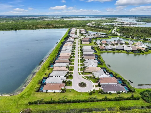 Aerial perspective of suburban area with a large body of water
