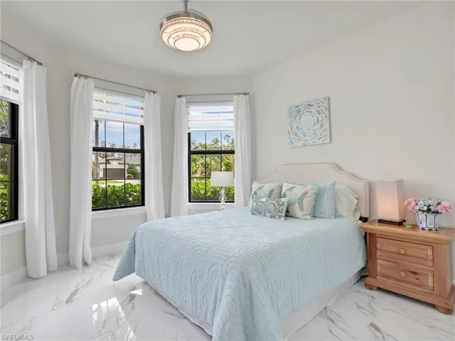 Bedroom with marble finish floors
