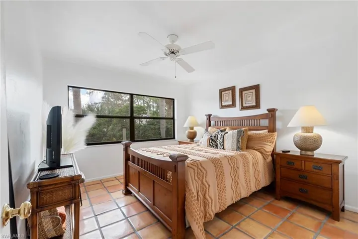 Bedroom featuring a ceiling fan and light tile patterned flooring