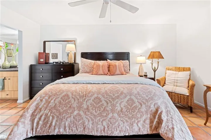 Bedroom featuring light tile patterned flooring and ceiling fan