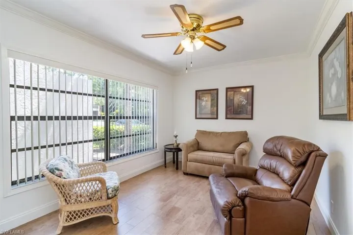 Sitting room featuring crown molding, light hardwood / wood-like flooring, and ceiling fan