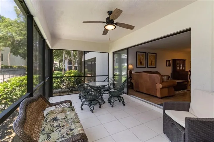 Sunroom / solarium featuring ceiling fan