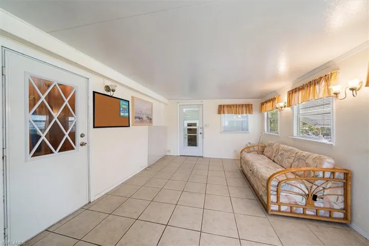 Sunroom featuring tile patterned flooring
