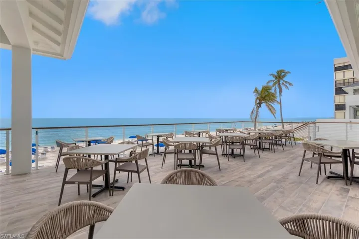 View of patio / terrace featuring outdoor dining space and a water view