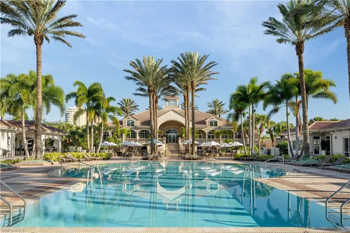 Community pool with a patio