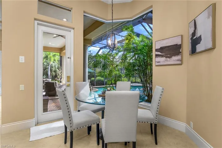 Dining space featuring healthy amount of natural light and suspended lighting