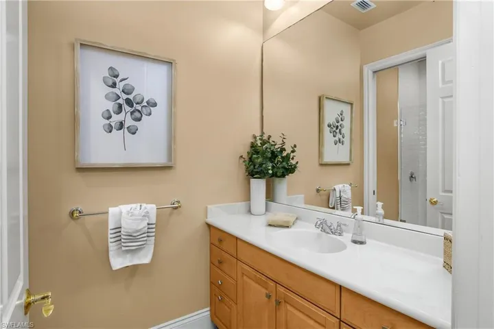 Full bath with vanity and an enclosed shower