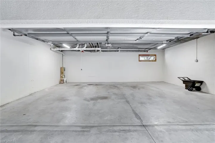 View of 2.5 car private garage located under building