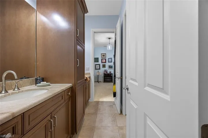 Bathroom featuring tile patterned floors and vanity