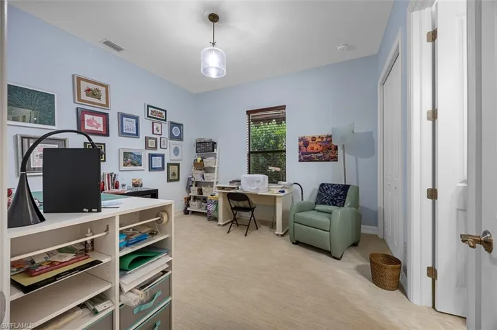 View of carpeted home office