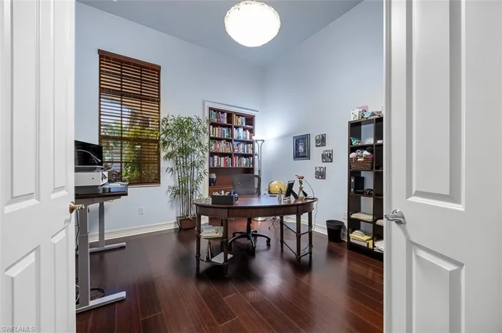 Office featuring dark hardwood / wood-style floors