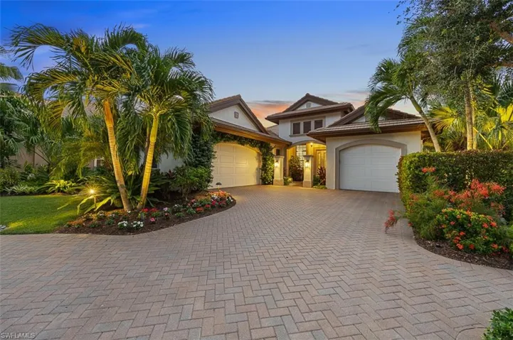 View of front facade featuring a garage