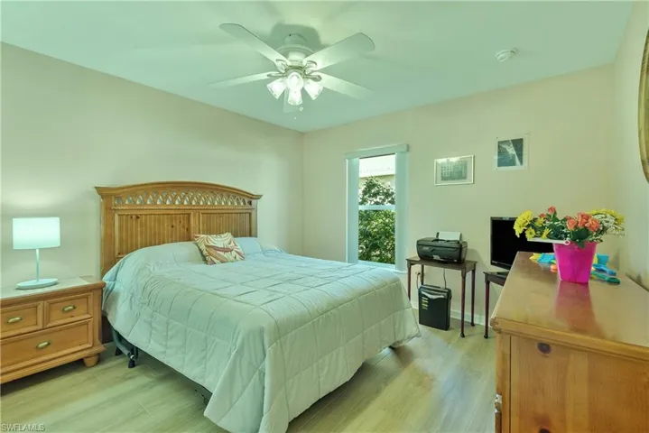 Bedroom with light wood-style flooring and ceiling fan