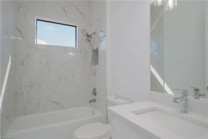 Full bath with toilet, tub / shower combination, and vanity