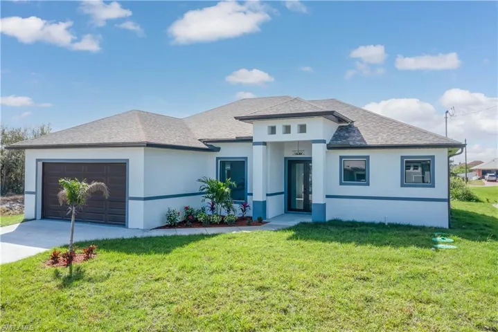 View of front of property with a garage, concrete driveway, roof with shingles, stucco siding, and a front lawn
