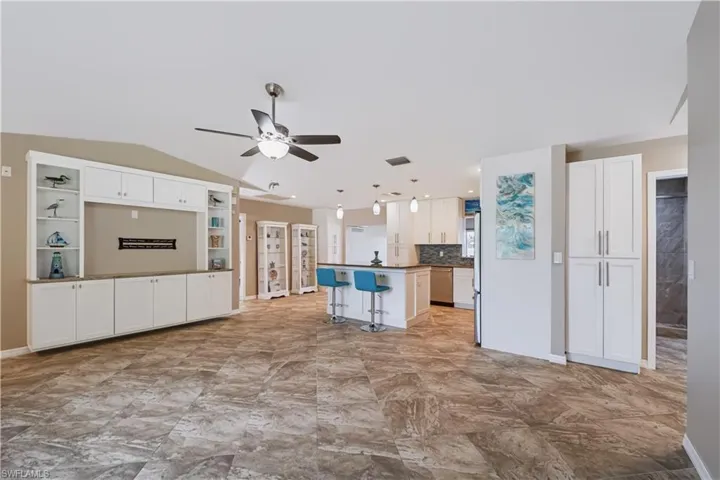 Great Room when you walk into the home. Notice the built in cabinets,nice kitchen storage, fan lights in all rooms, ceramic tiles throughout!